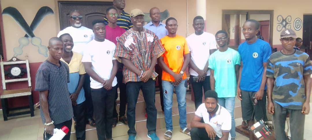 Bekwai Youth Movement members gathered with a community elder