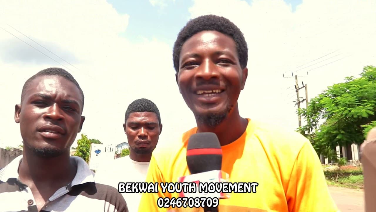 A BYM member speaking on the street with a movement microphone